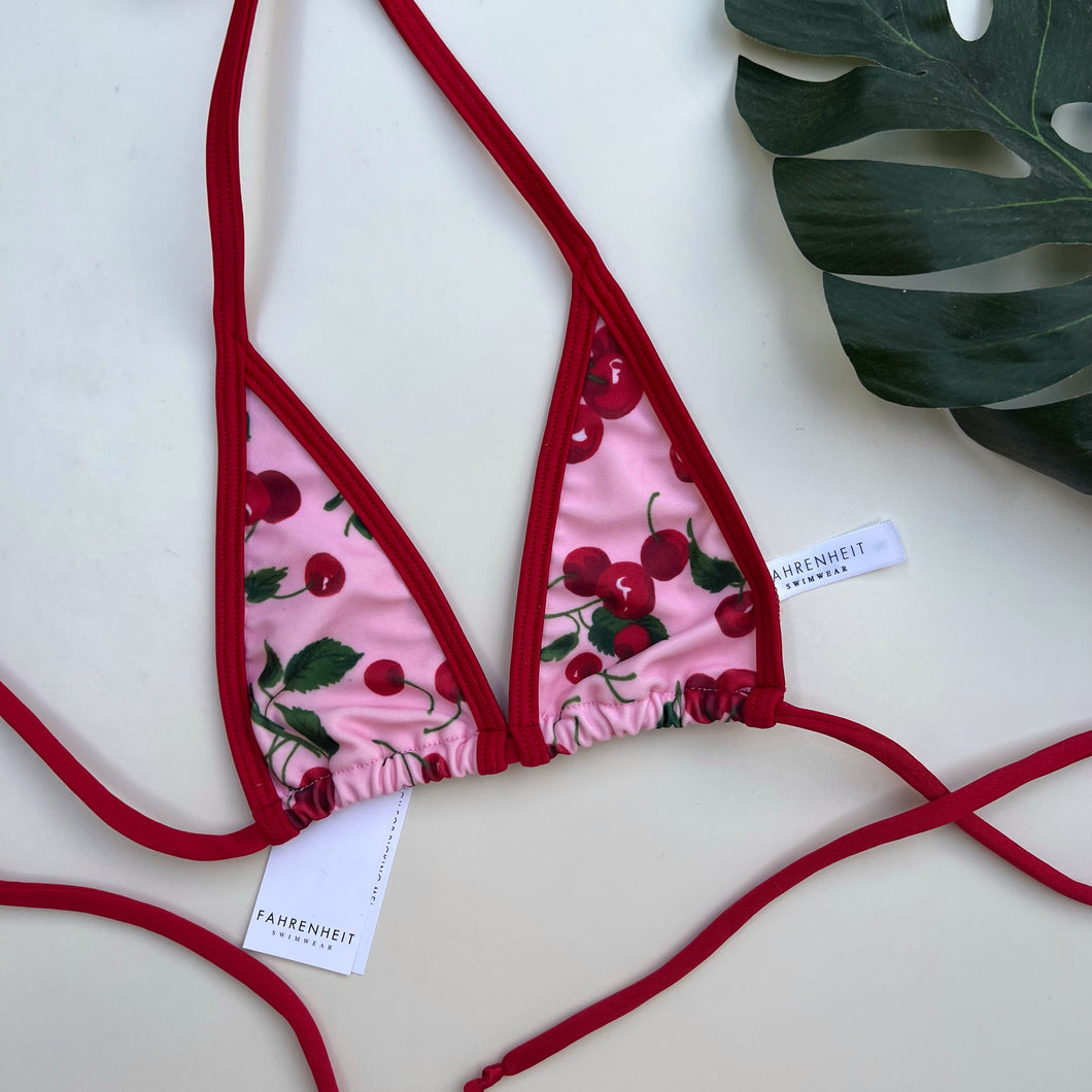 Red Cherry Extreme Micro Bikini Top on Pink Background with Red Trim - Brazilian Cute Fruit Bikini - Fahrenheit Swimwear